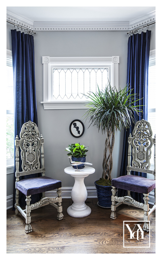 Interesting vignette of the dining room. She managed to make these vintage chairs work with the finish treatment and bold color choices.   So much personality in this room.