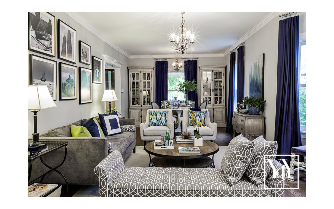 Overview of the living room. Love the salon style art work above the sofa.